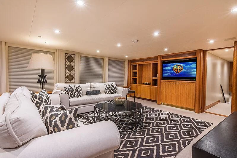 a living room with a large tv aboard SEA CLASS Yacht for Sale