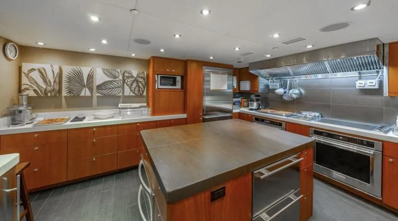 a kitchen with a large island aboard SEA CLASS Yacht for Sale