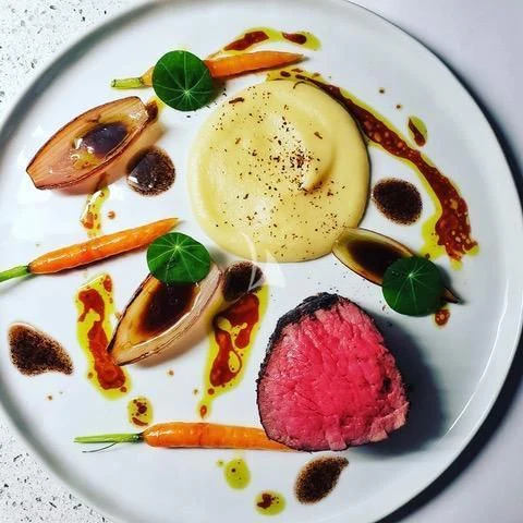 a plate of food aboard SEA CLASS Yacht for Sale
