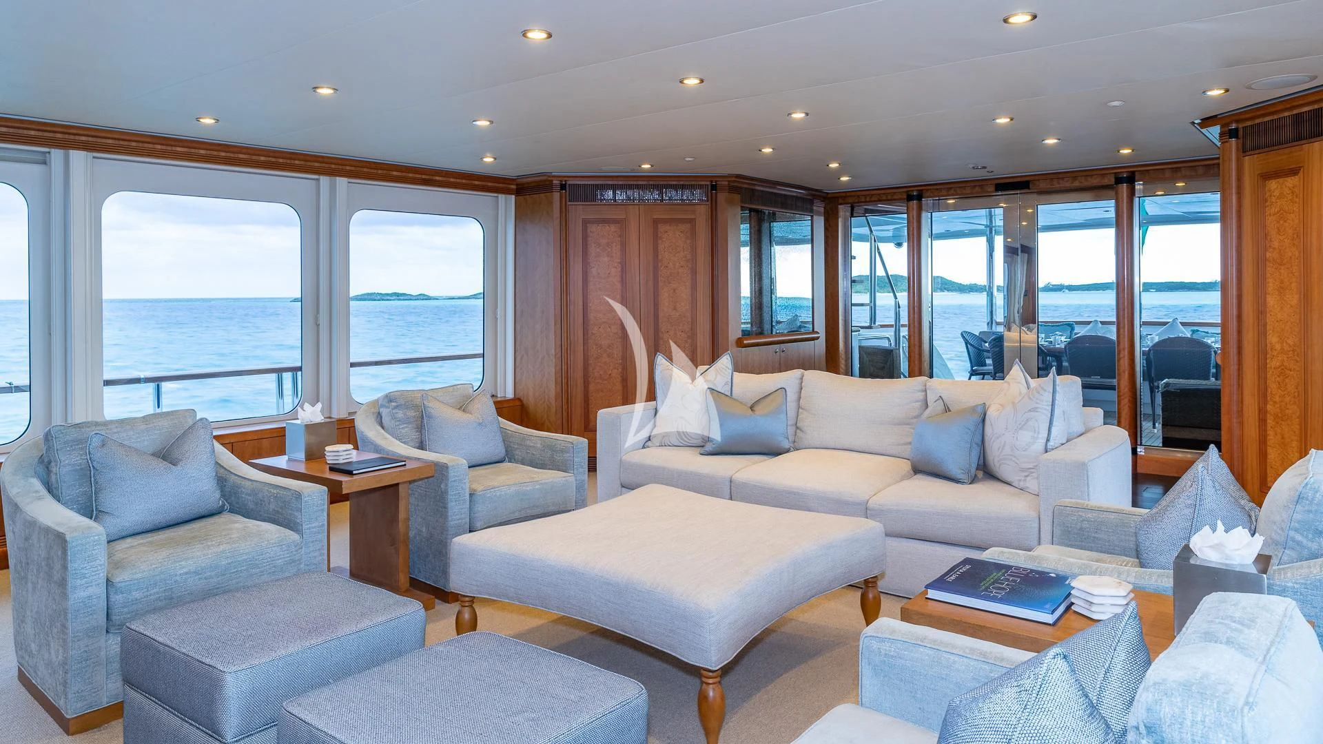 a living room with a large window aboard SEA CLASS Yacht for Sale