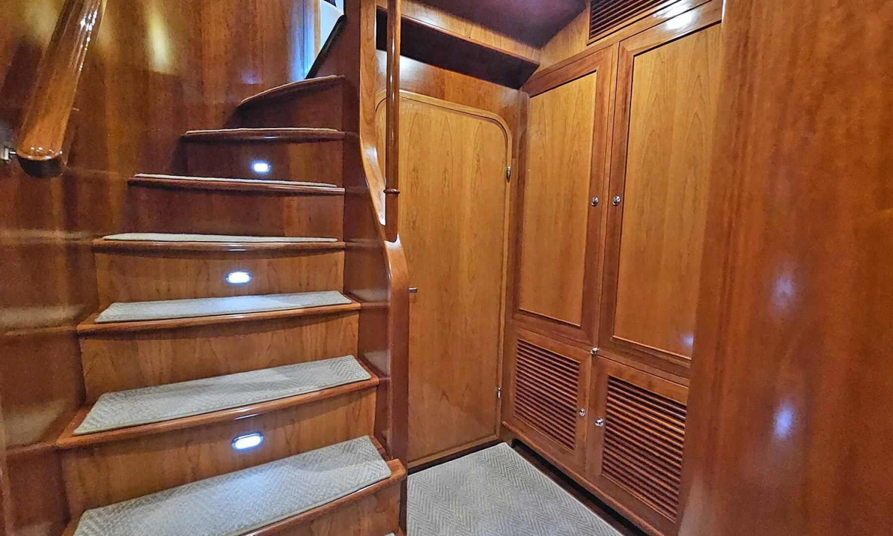 a wooden staircase with wooden doors aboard MY KIMBERLY Yacht for Sale