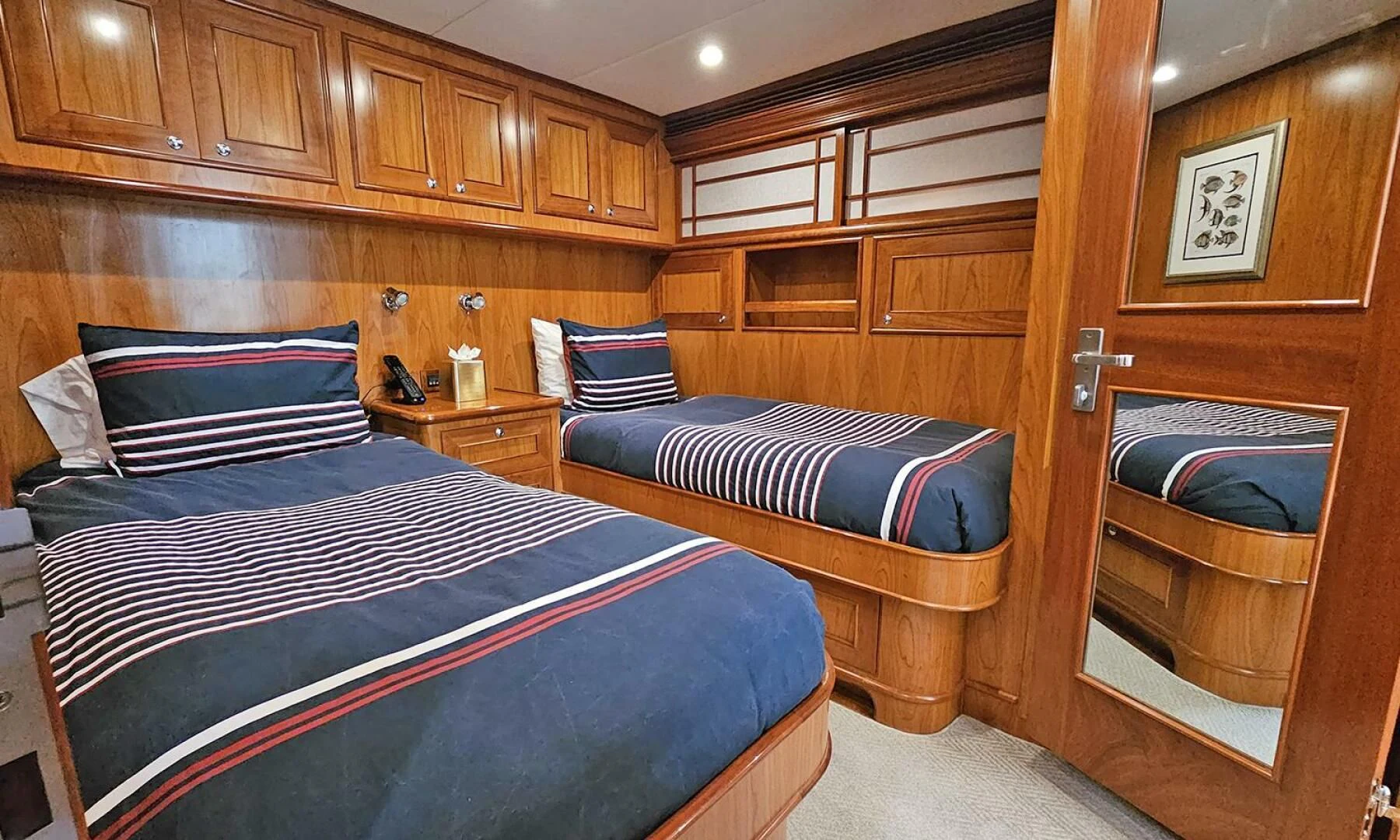a room with a bed and a fireplace aboard MY KIMBERLY Yacht for Sale