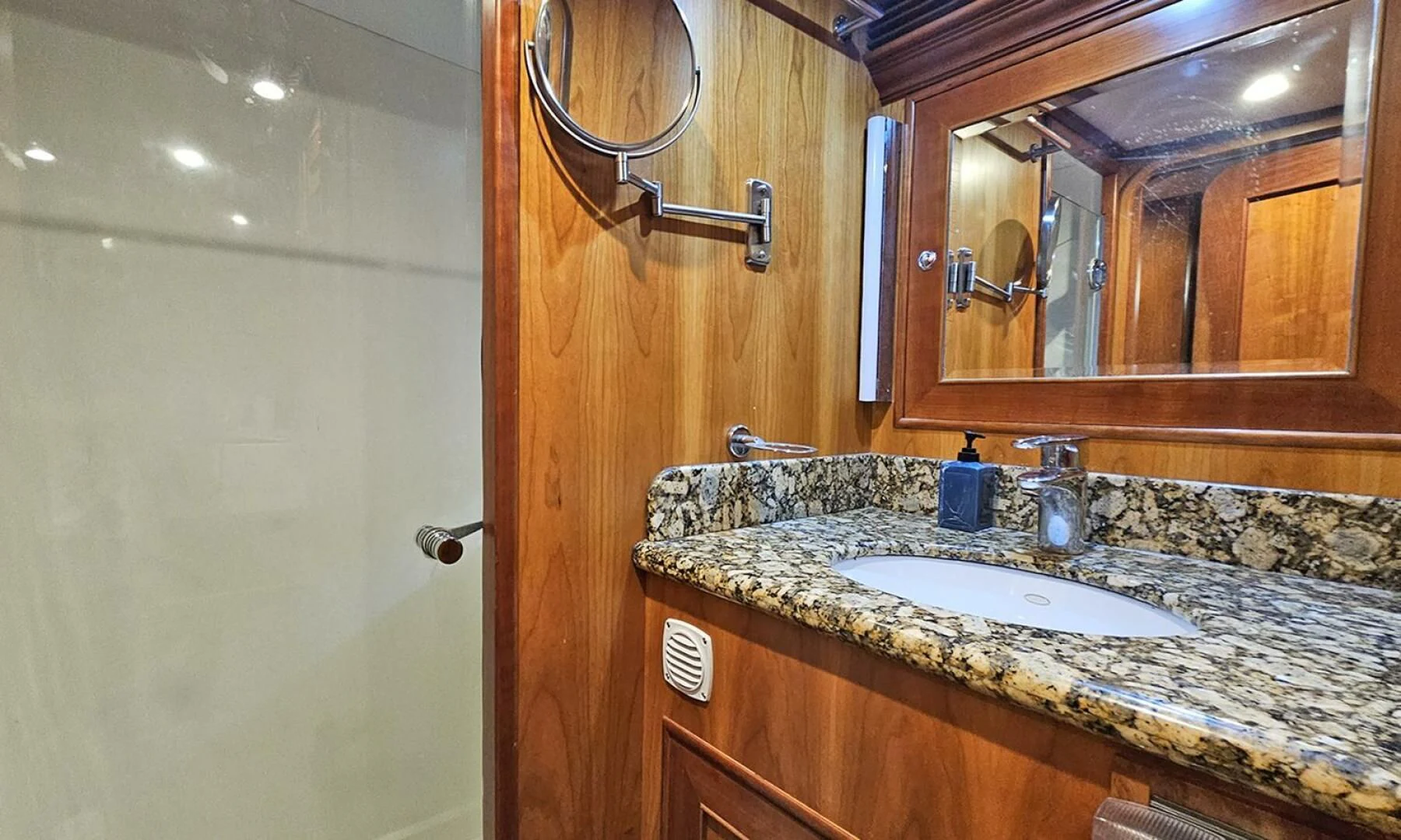 a bathroom with a countertop sink and mirror aboard MY KIMBERLY Yacht for Sale