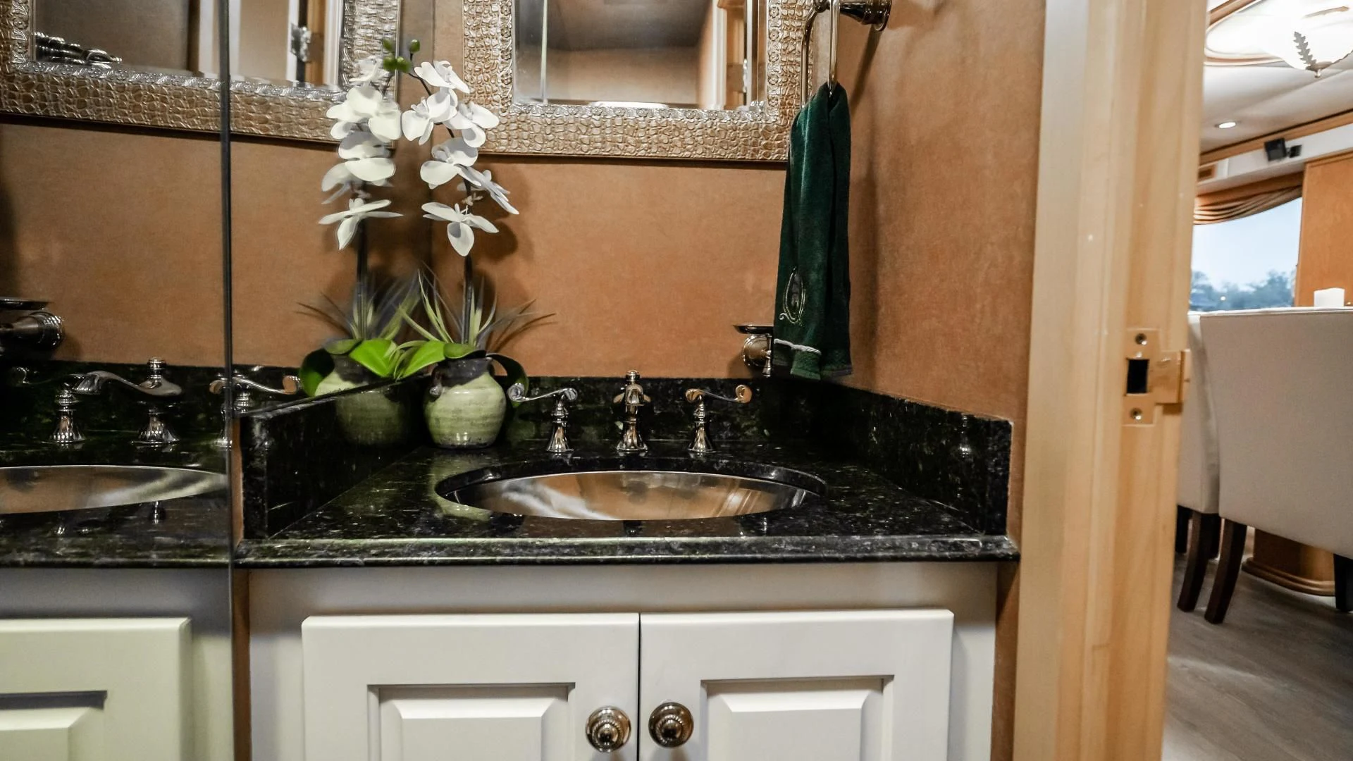 a kitchen with a sink and a plant on the counter aboard BUSINESS TRIP 2 Yacht for Sale