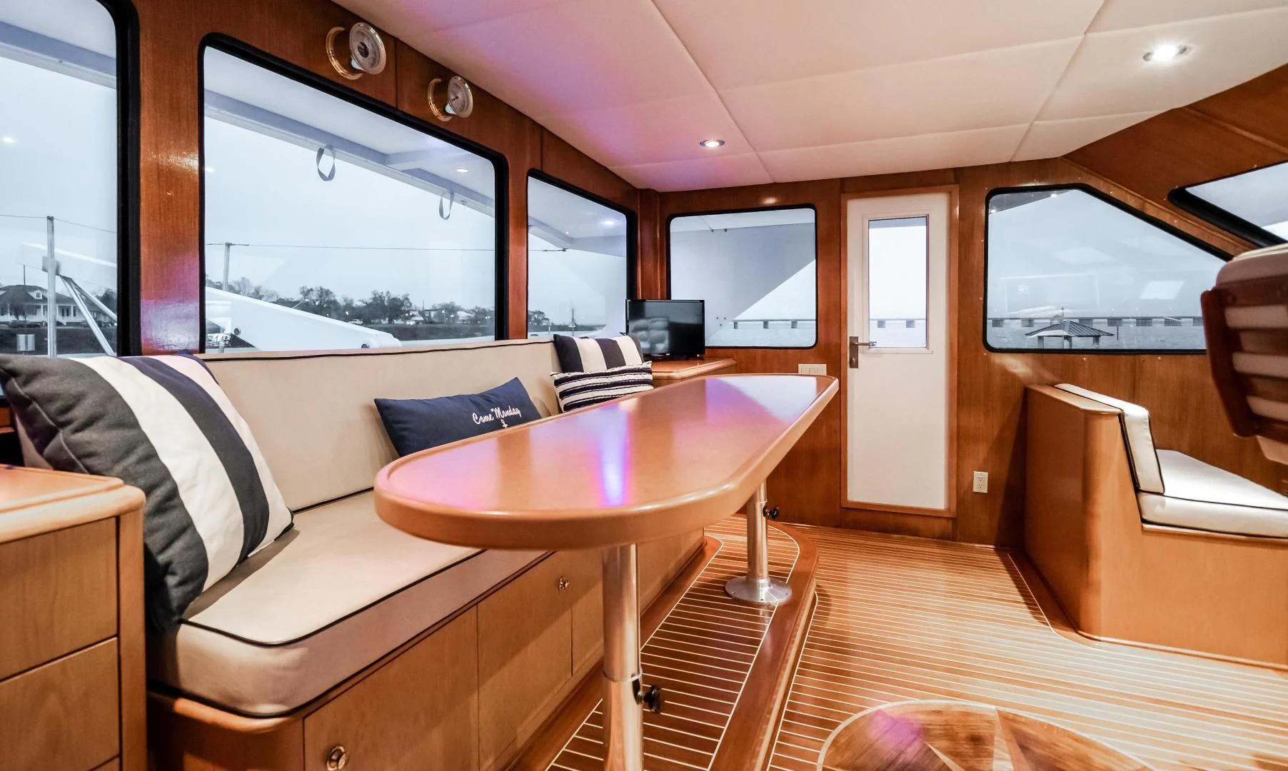 a living room with a table and couches aboard BUSINESS TRIP 2 Yacht for Sale