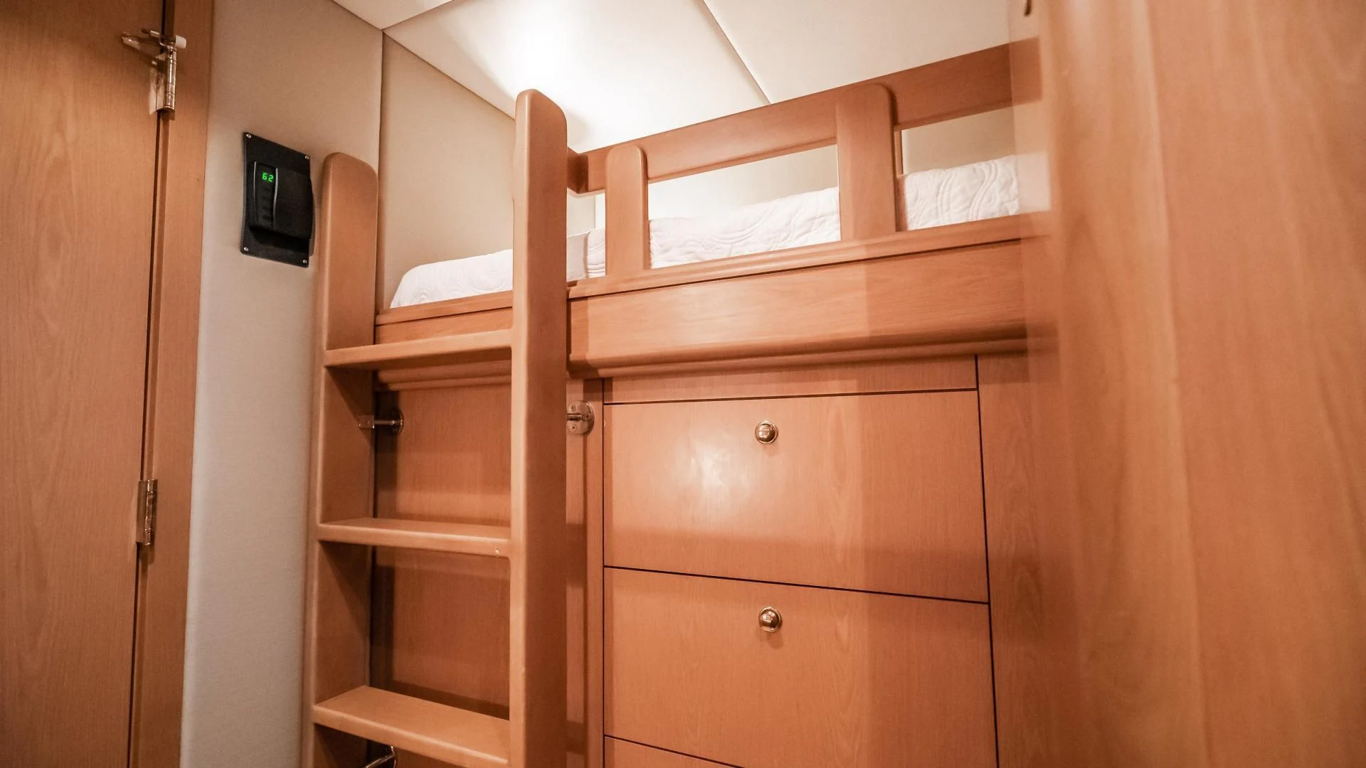 a wooden shelf with a phone on it aboard BUSINESS TRIP 2 Yacht for Sale