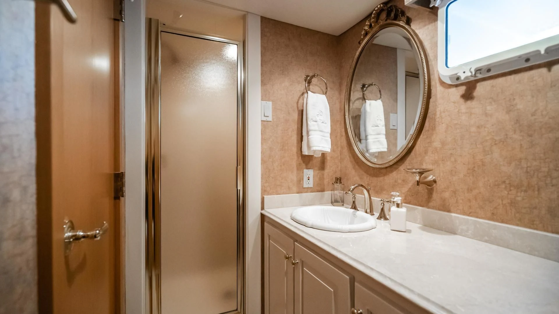 a bathroom with a large mirror aboard BUSINESS TRIP 2 Yacht for Sale