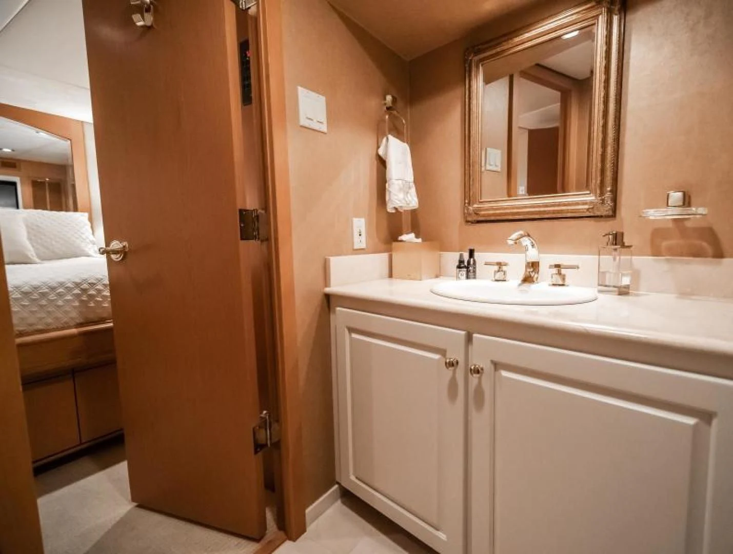 a bathroom with a sink and a mirror aboard BUSINESS TRIP 2 Yacht for Sale