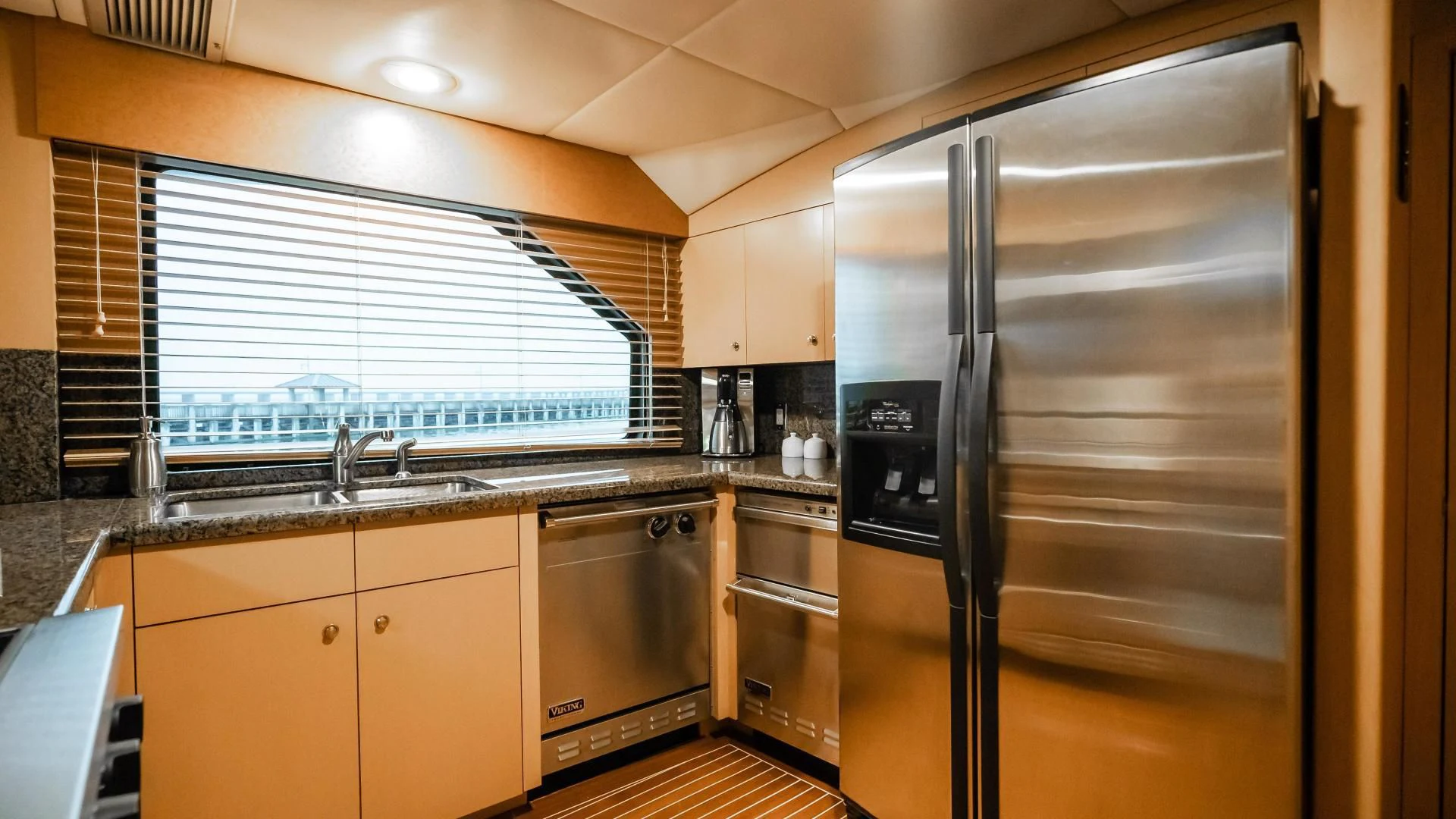 a kitchen with stainless steel appliances aboard BUSINESS TRIP 2 Yacht for Sale