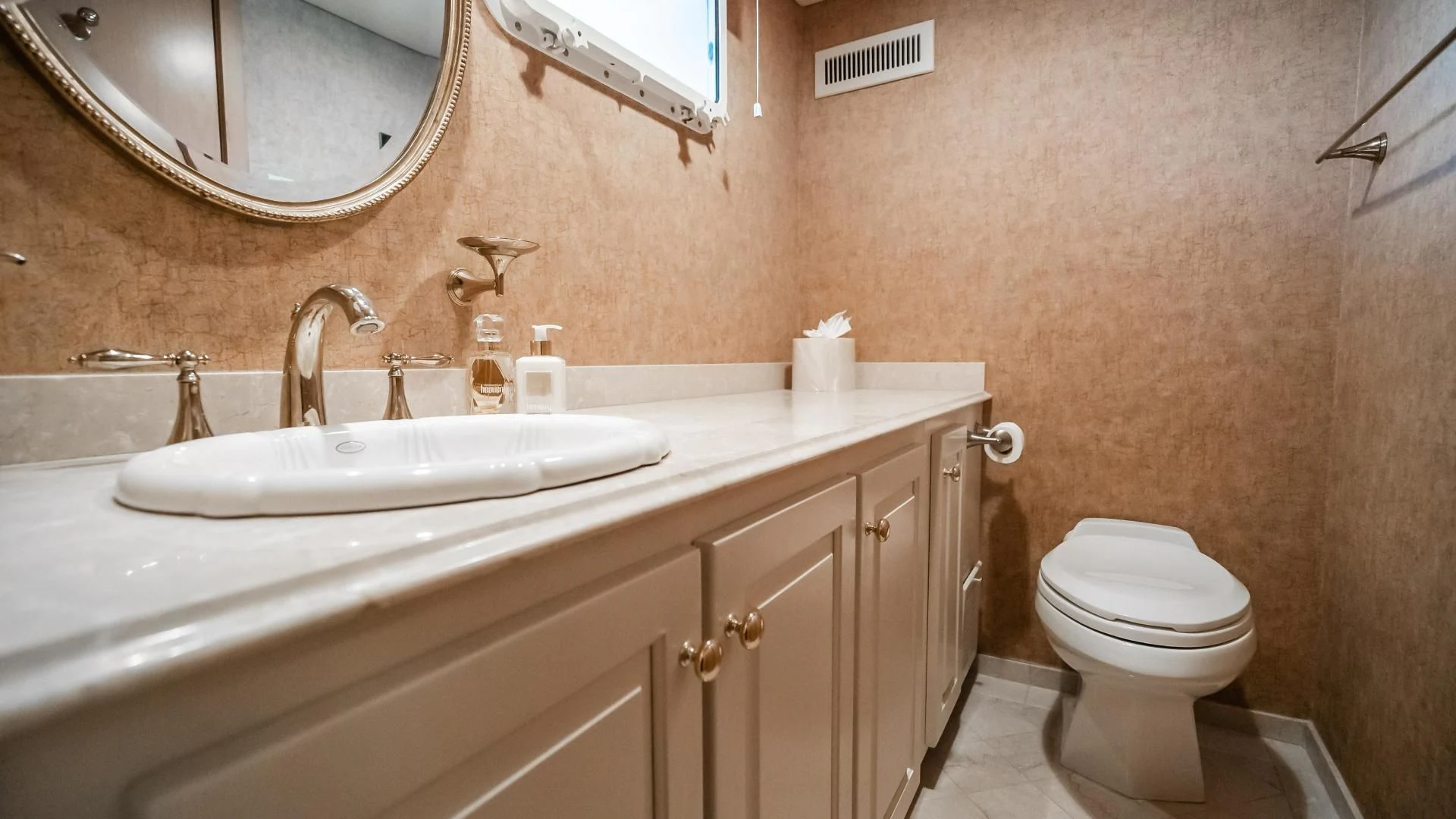 a bathroom with a toilet sink and a mirror aboard BUSINESS TRIP 2 Yacht for Sale