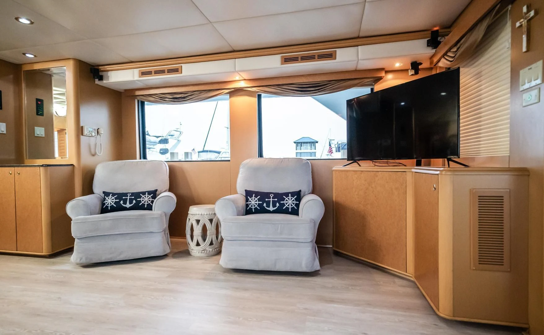 a living room with a couch and a tv aboard BUSINESS TRIP 2 Yacht for Sale