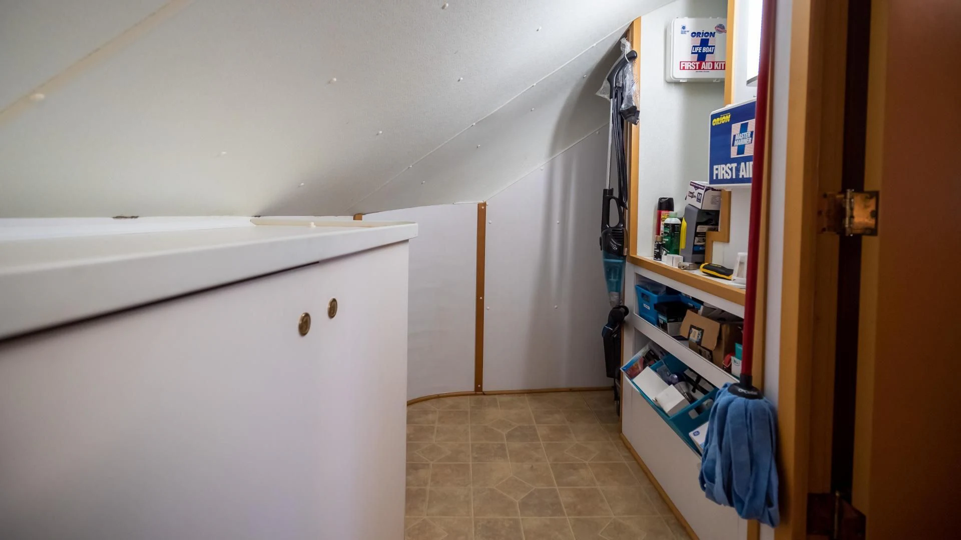 a room with a closet and shelves aboard BUSINESS TRIP 2 Yacht for Sale