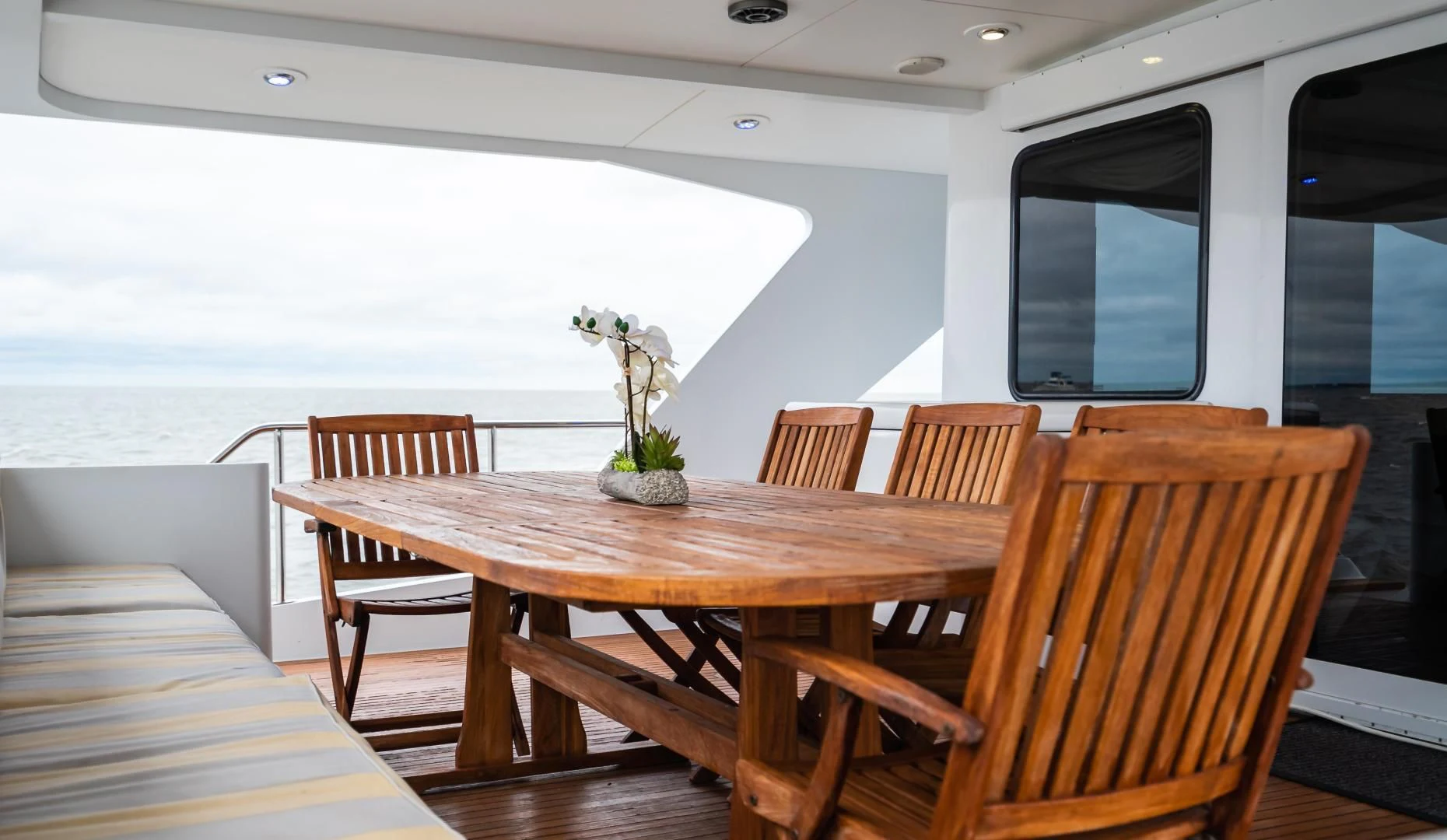 a table with chairs around it aboard BUSINESS TRIP 2 Yacht for Sale