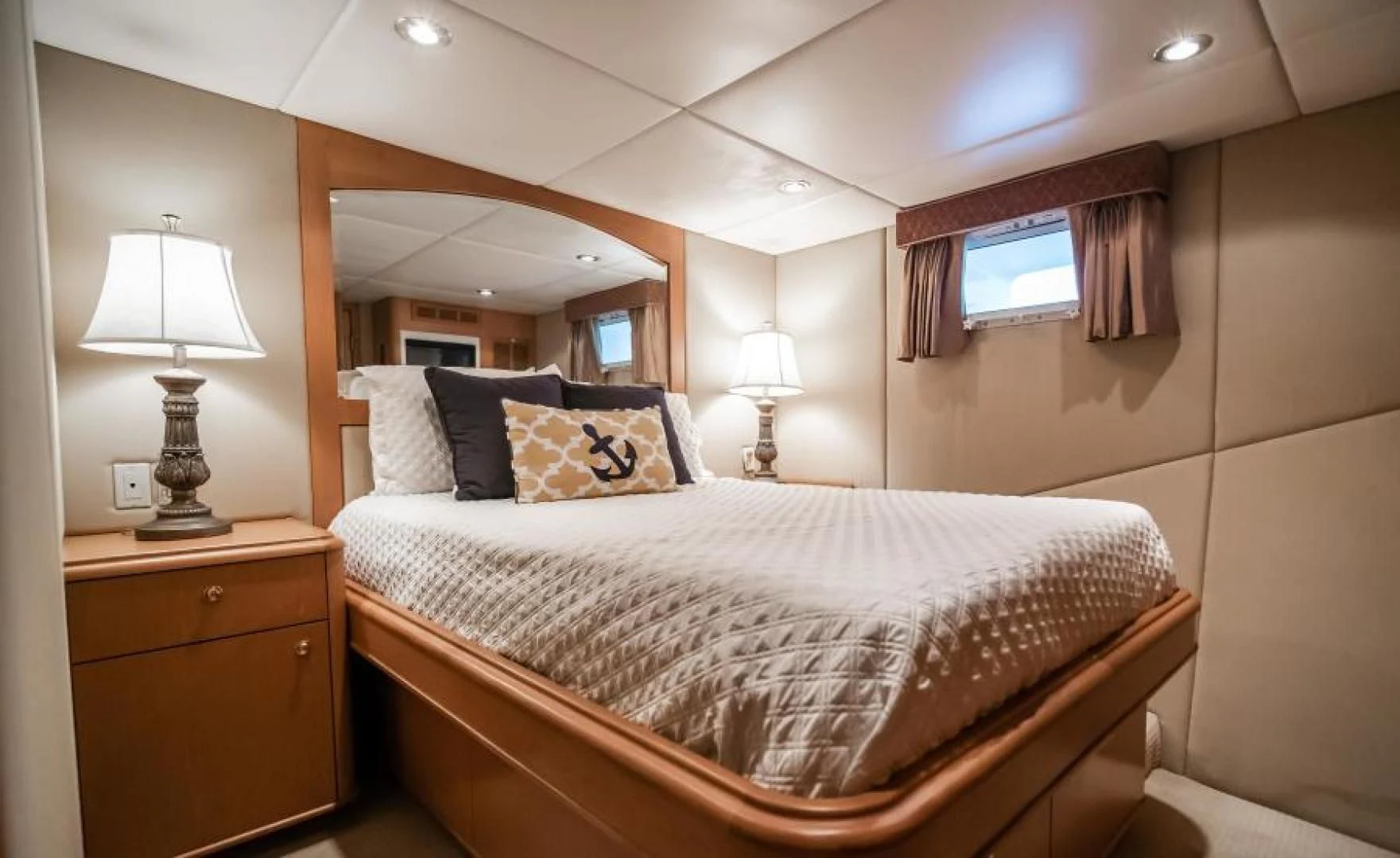 a bed with a white bed spread aboard BUSINESS TRIP 2 Yacht for Sale