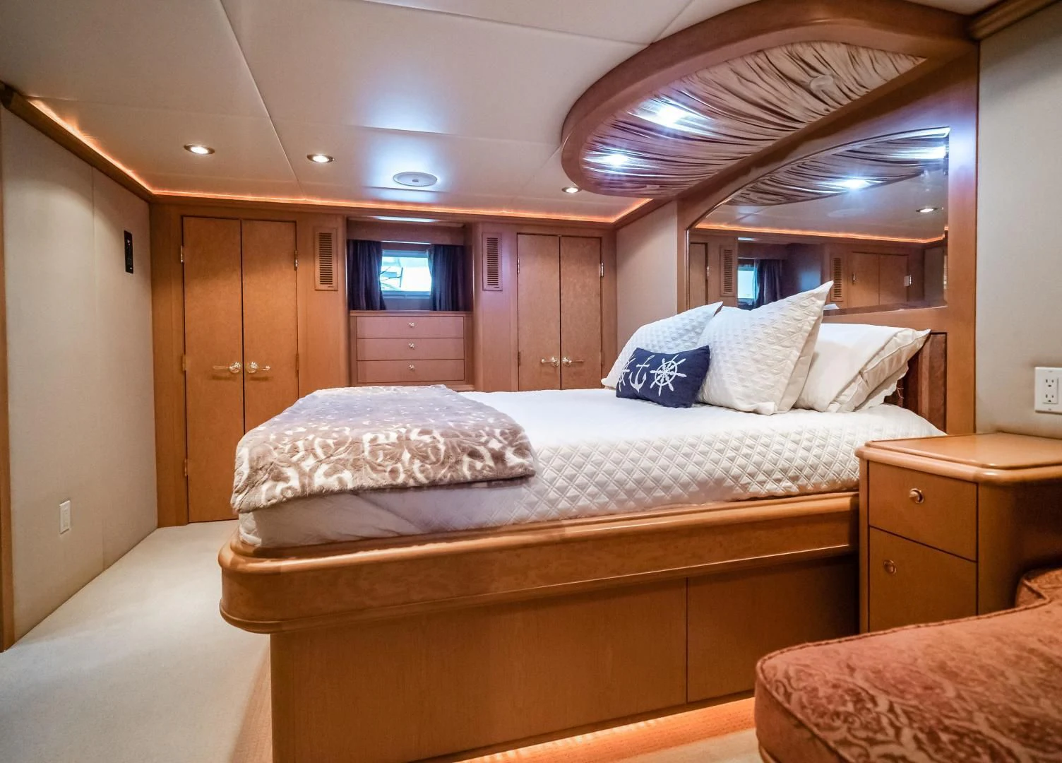 a bedroom with a bed and a ceiling fan aboard BUSINESS TRIP 2 Yacht for Sale
