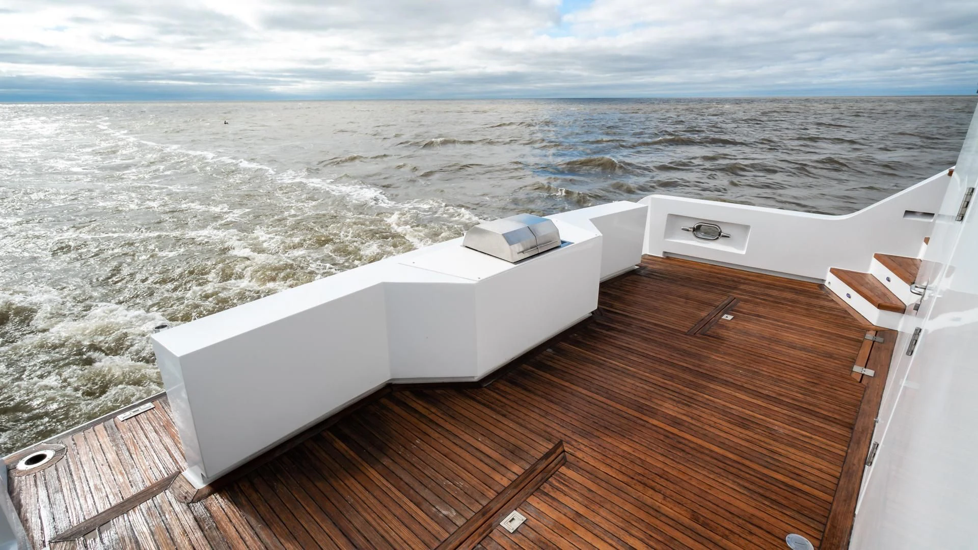 a deck with a view of the ocean and the ocean aboard BUSINESS TRIP 2 Yacht for Sale