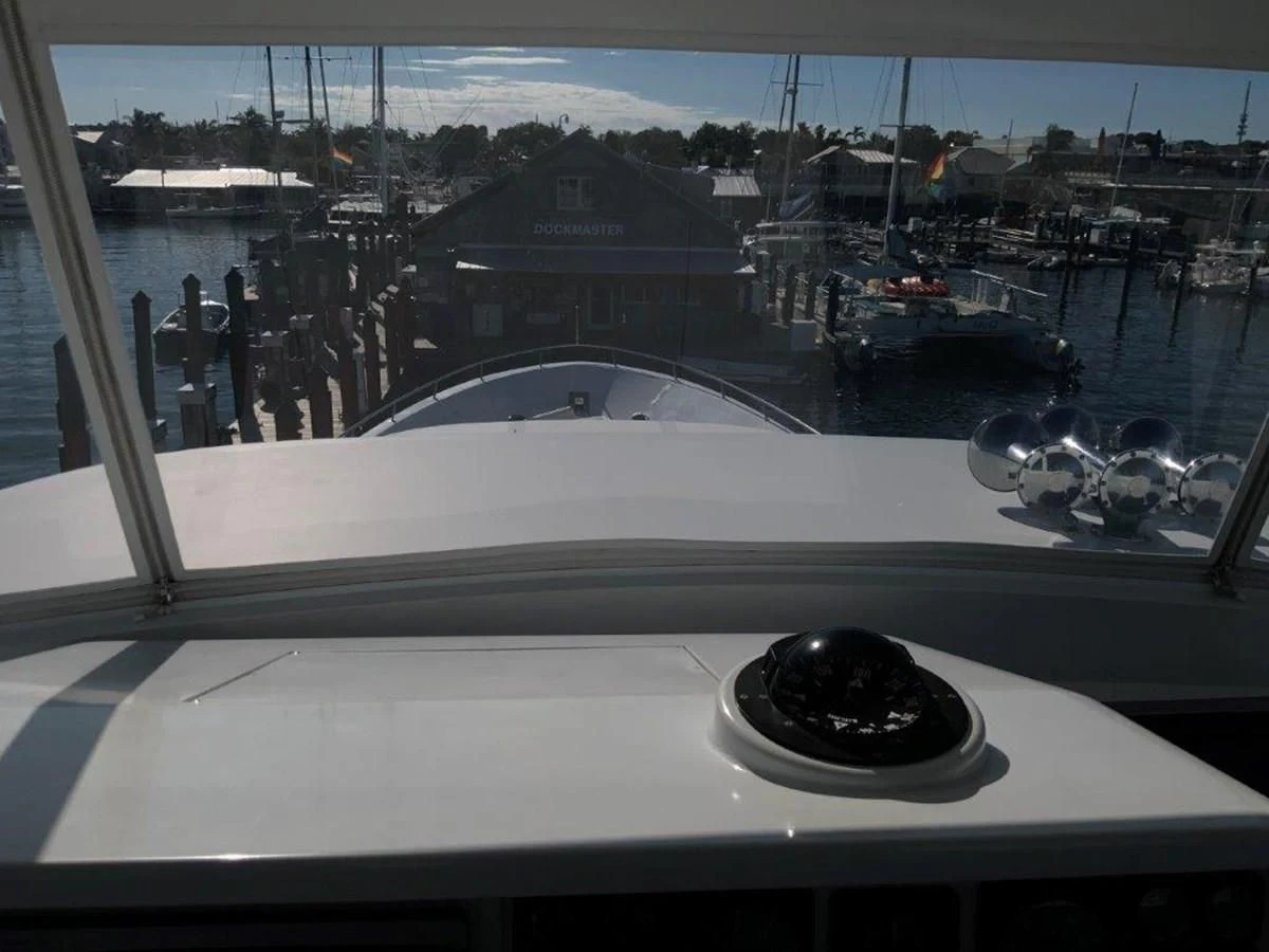 a window with a view of a city and water aboard LADY GRACE Yacht for Sale