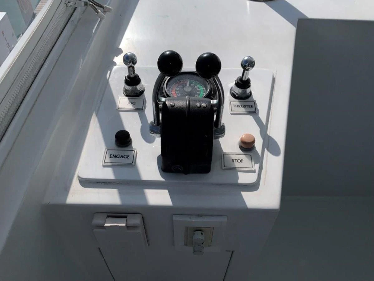 a black and silver faucet on a white shelf aboard LADY GRACE Yacht for Sale