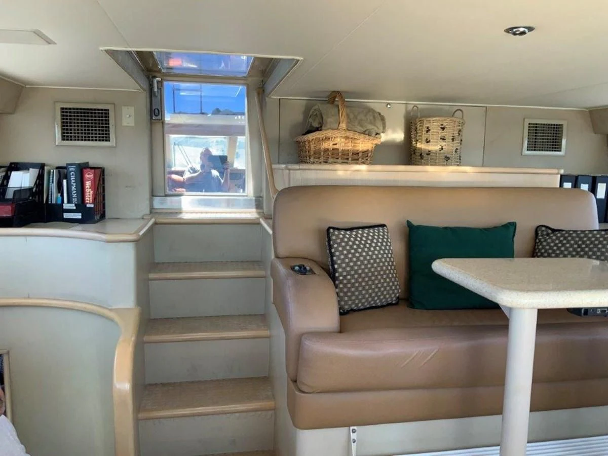a room with a couch and a table aboard LADY GRACE Yacht for Sale