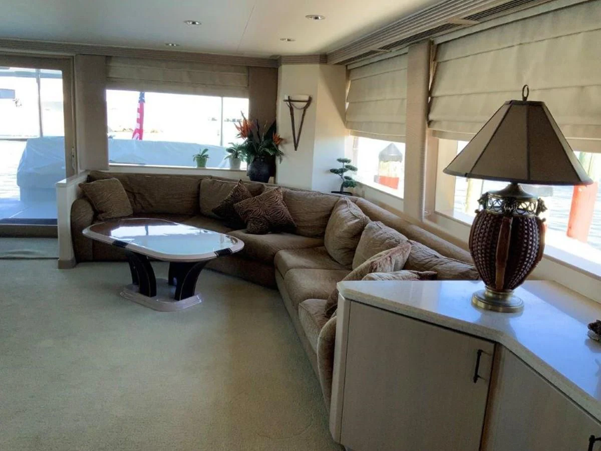 a living room with a couch and a table aboard LADY GRACE Yacht for Sale