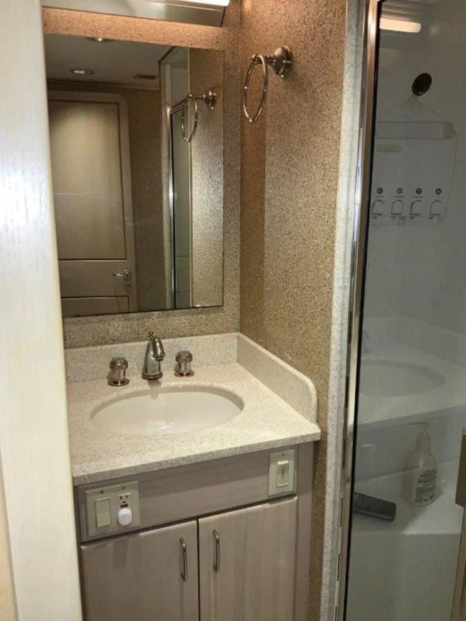a bathroom with a sink and a mirror aboard LADY GRACE Yacht for Sale