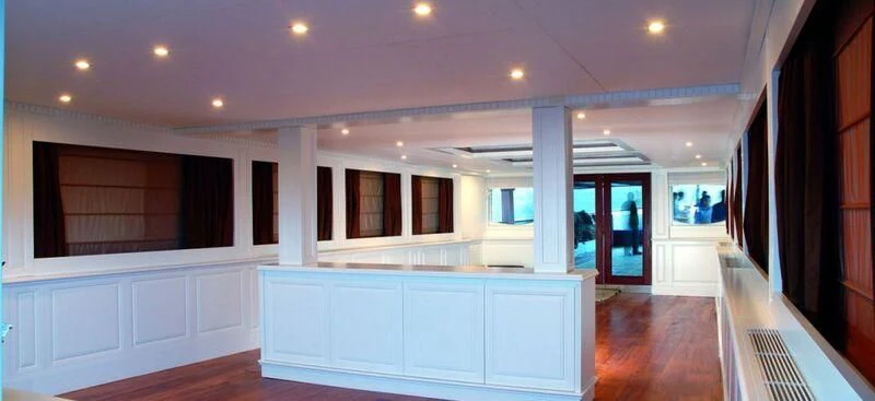 a room with a large white counter and a wood floor aboard ARGOSSY Yacht for Sale