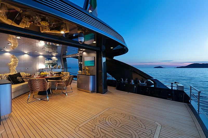 a large room with a large glass wall and a large body of water aboard FREEDOM Yacht for Sale