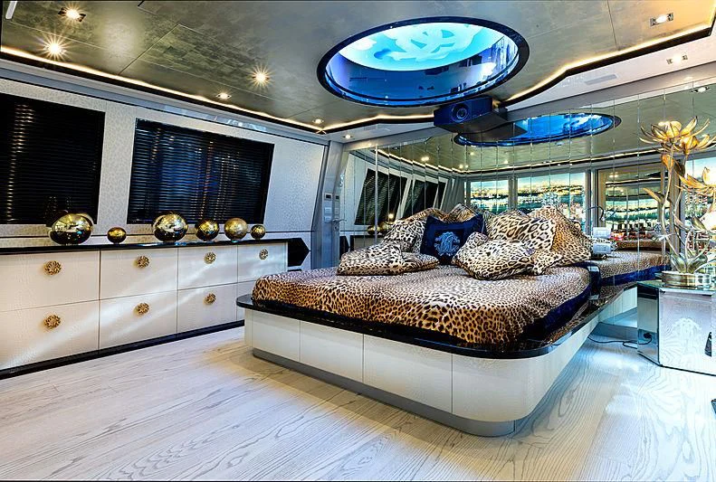 a large bedroom with a large mirror aboard FREEDOM Yacht for Sale