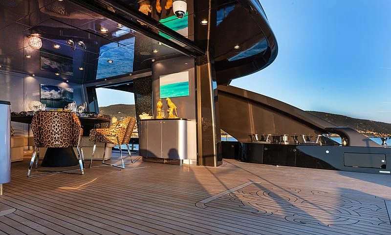 a room with a table and chairs aboard FREEDOM Yacht for Sale