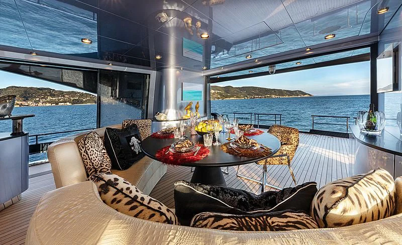 a room with a table and chairs aboard FREEDOM Yacht for Sale