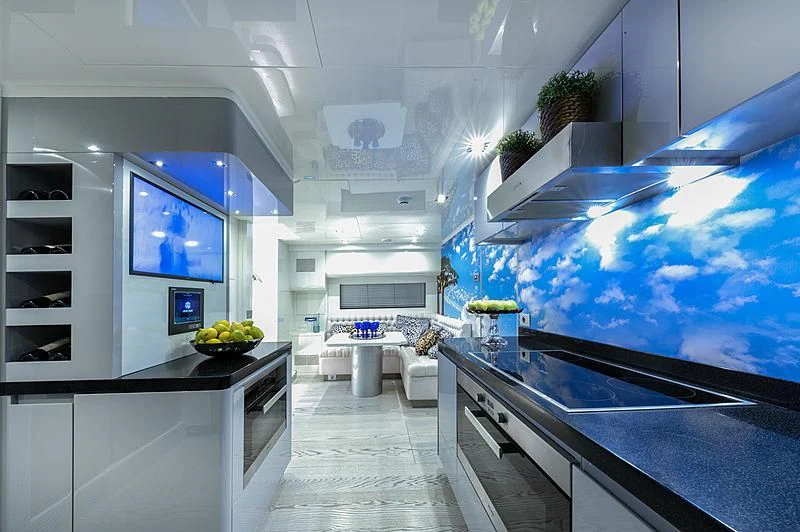 a kitchen with white cabinets aboard FREEDOM Yacht for Sale