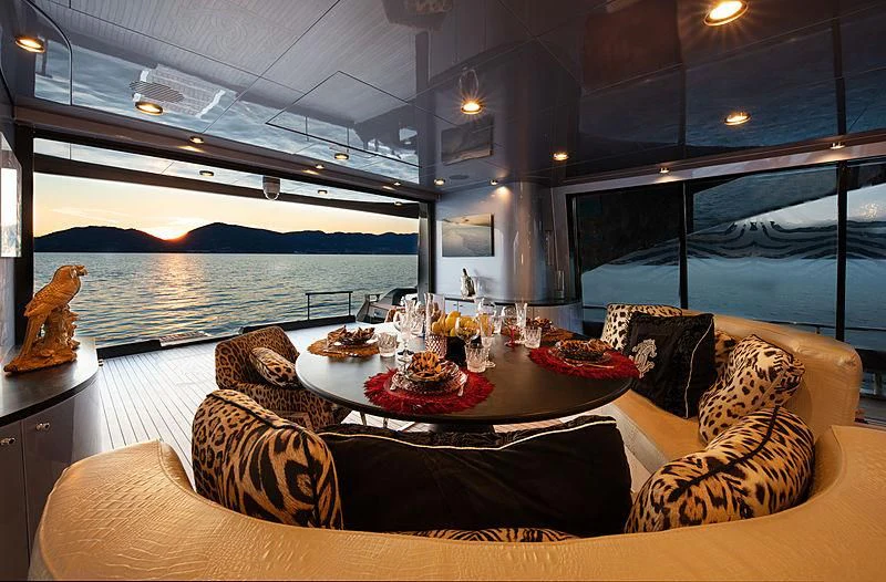 a room with a table and chairs aboard FREEDOM Yacht for Sale