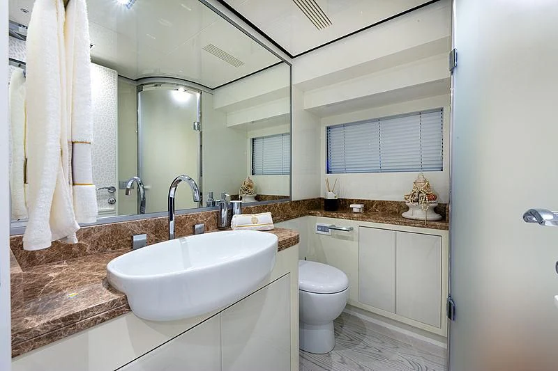 a bathroom with a sink and toilet aboard FREEDOM Yacht for Sale