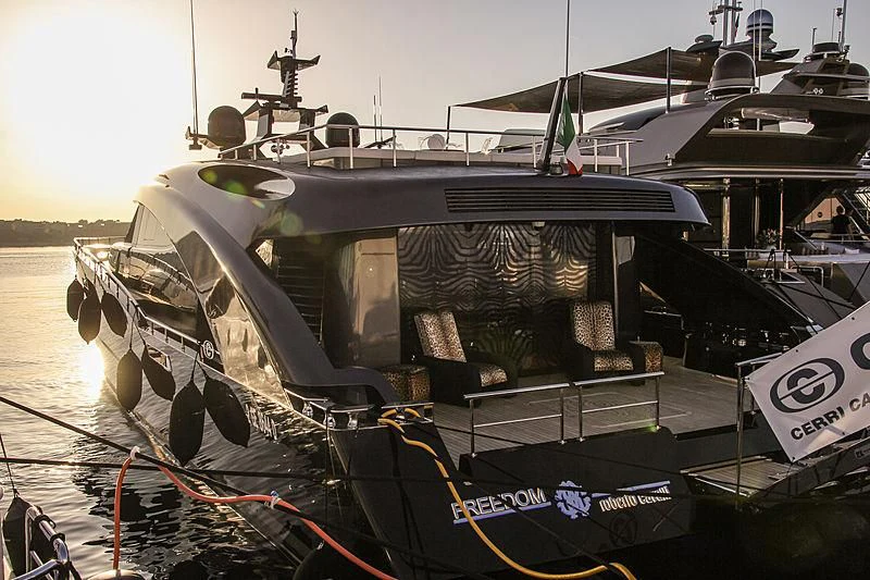 a large military ship docked aboard FREEDOM Yacht for Sale