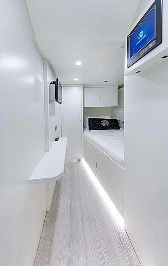 a room with a tv and a white wall aboard FREEDOM Yacht for Sale