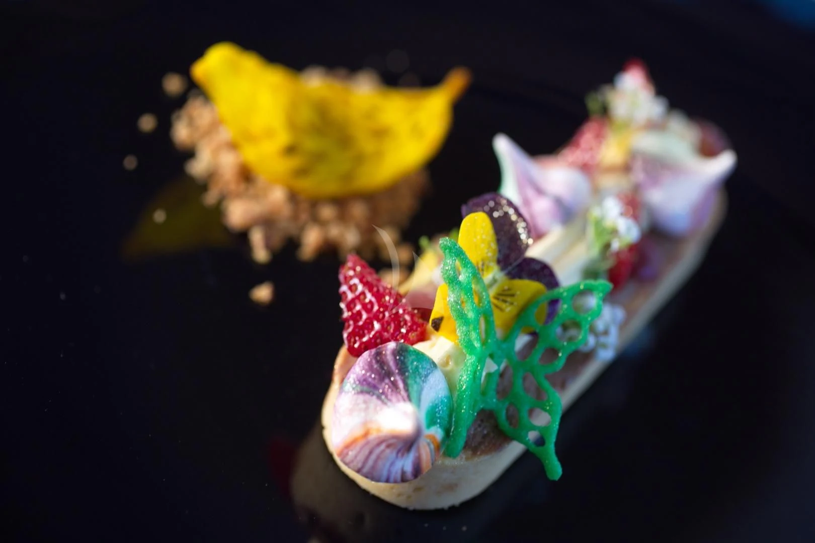 a colorful flower on a black surface aboard M/Y ANTHEA Yacht for Sale