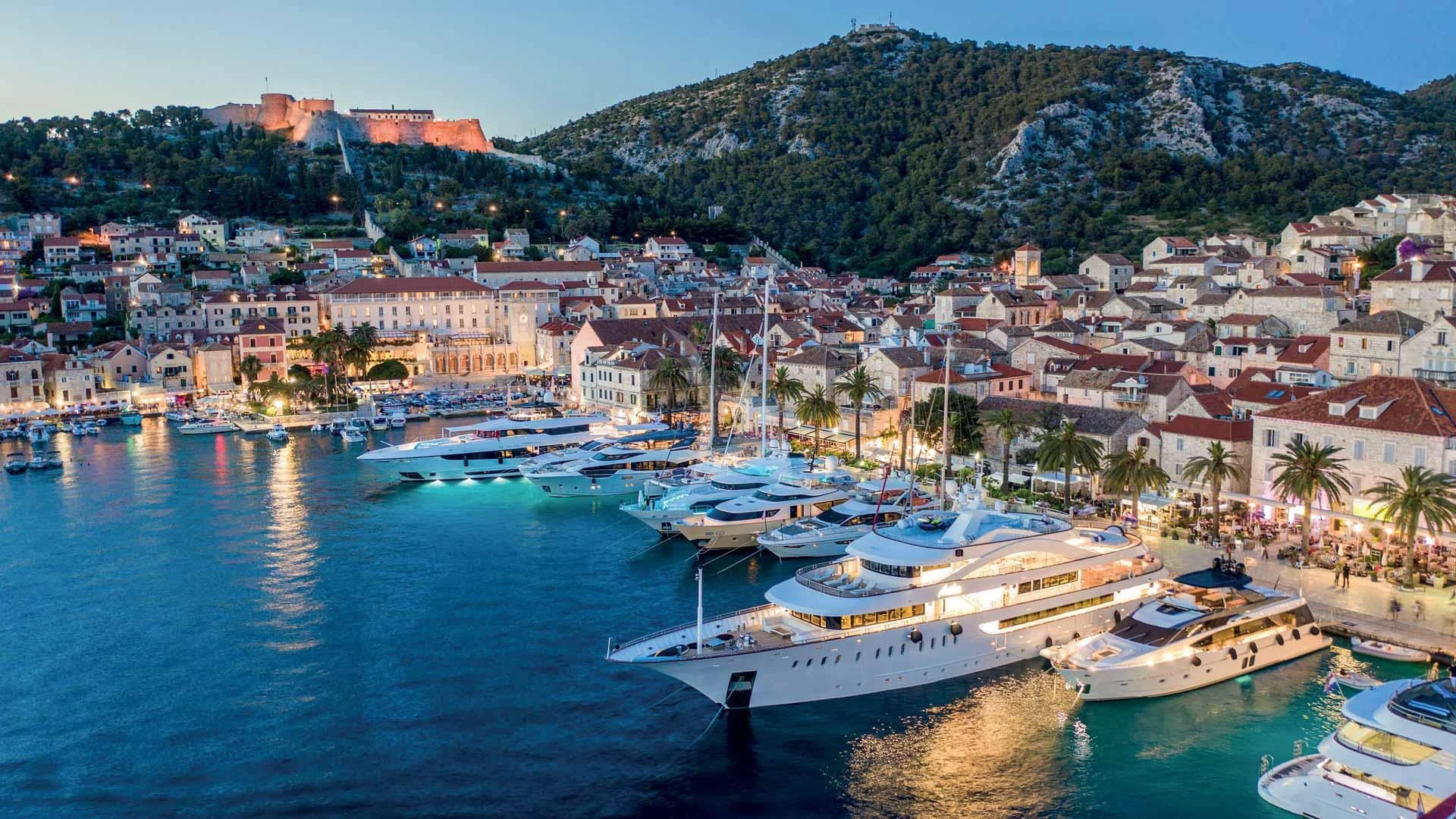a harbor with boats and buildings aboard M/Y ANTHEA Yacht for Sale