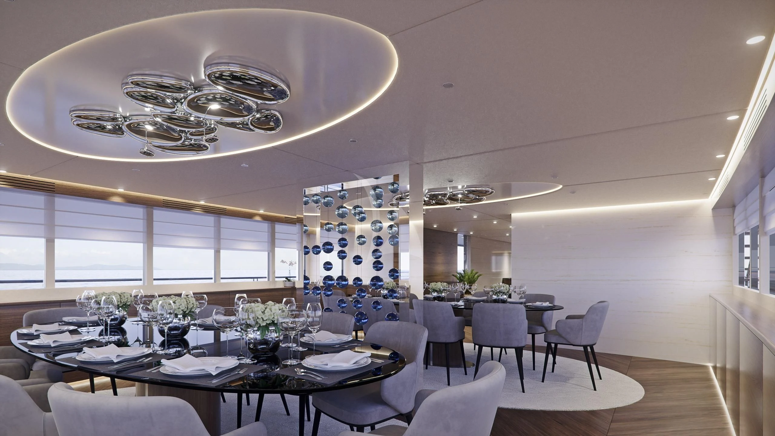 a dining room with tables and chairs aboard M/Y ANTHEA Yacht for Sale
