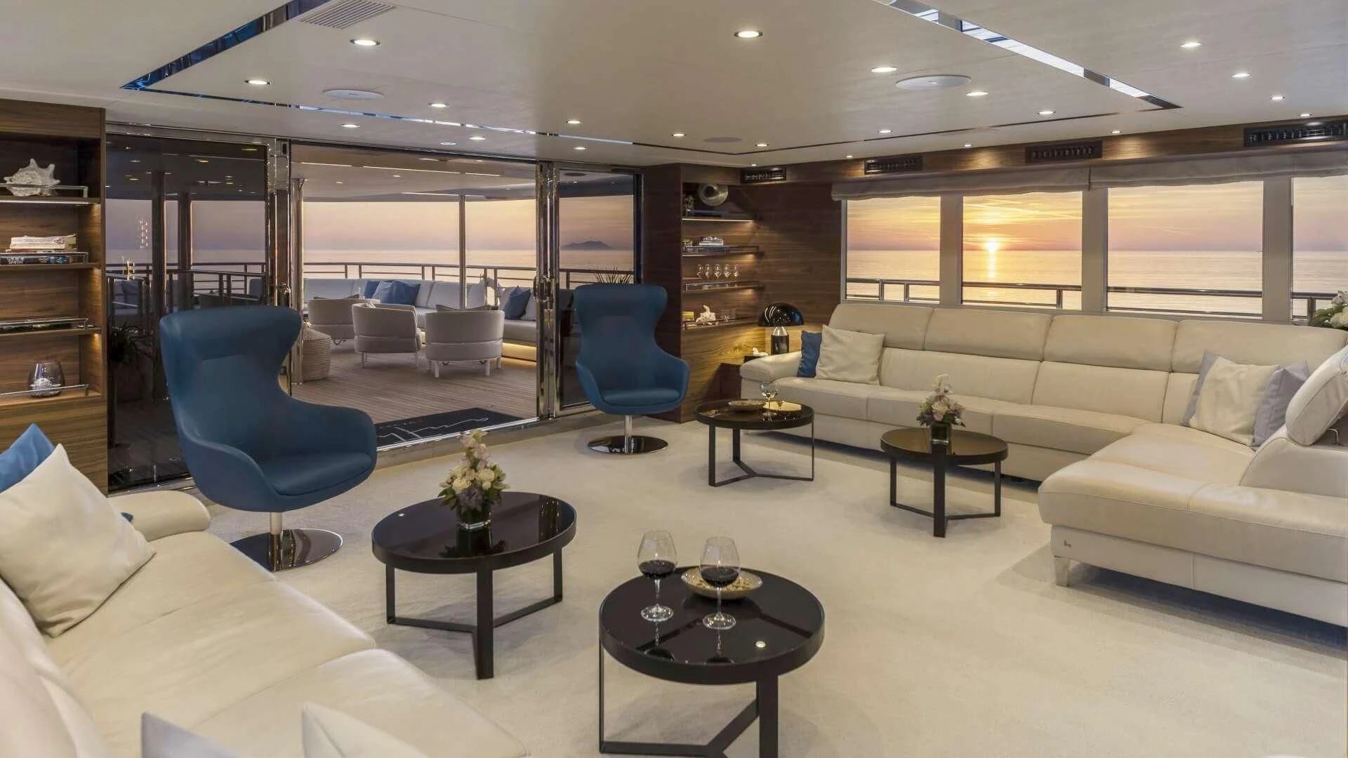 a living room with a couch and a coffee table aboard M/Y ANTHEA Yacht for Sale