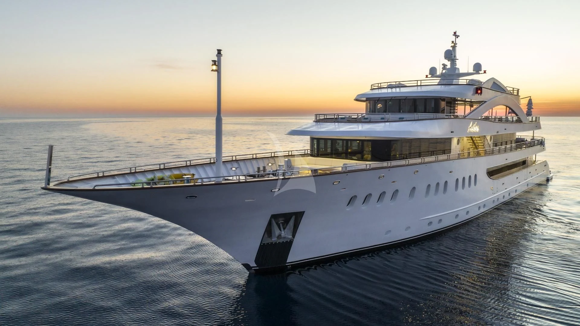 a large ship in the water aboard M/Y ANTHEA Yacht for Sale