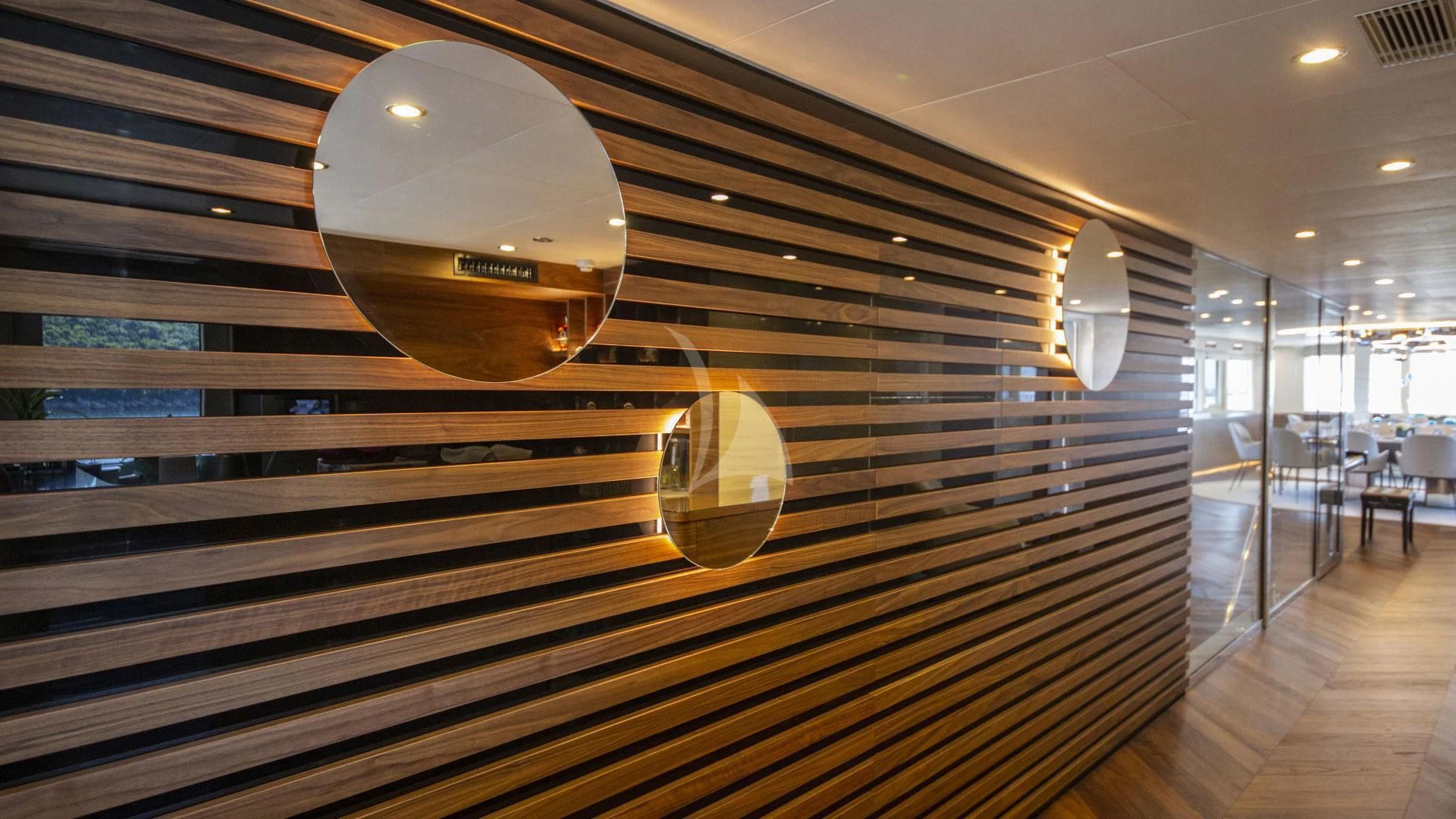 a large wood room with a large mirror and a large ceiling aboard M/Y ANTHEA Yacht for Sale