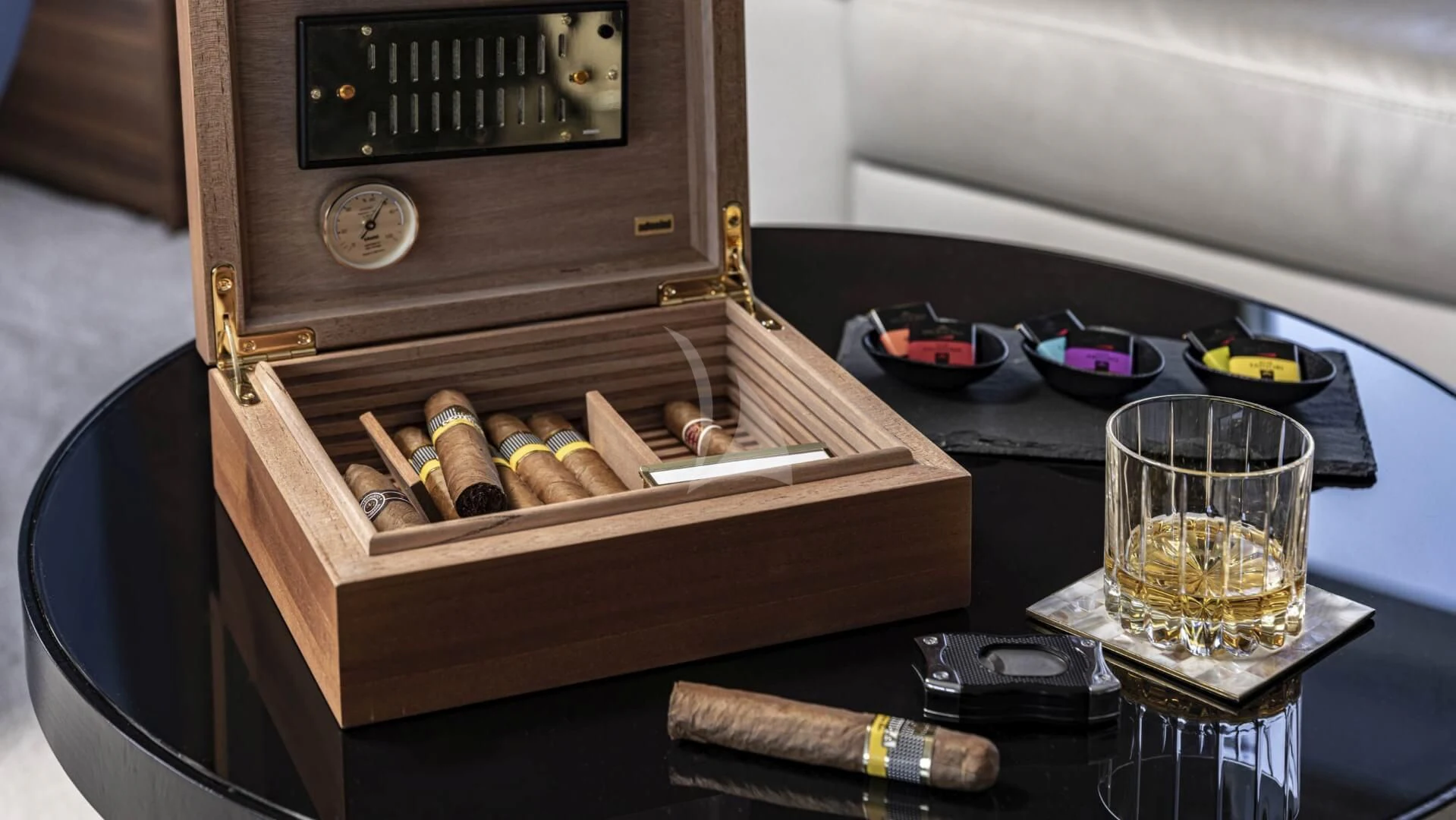 a wooden box with a glass of water and a wooden box with a wooden handle and a wooden aboard M/Y ANTHEA Yacht for Sale