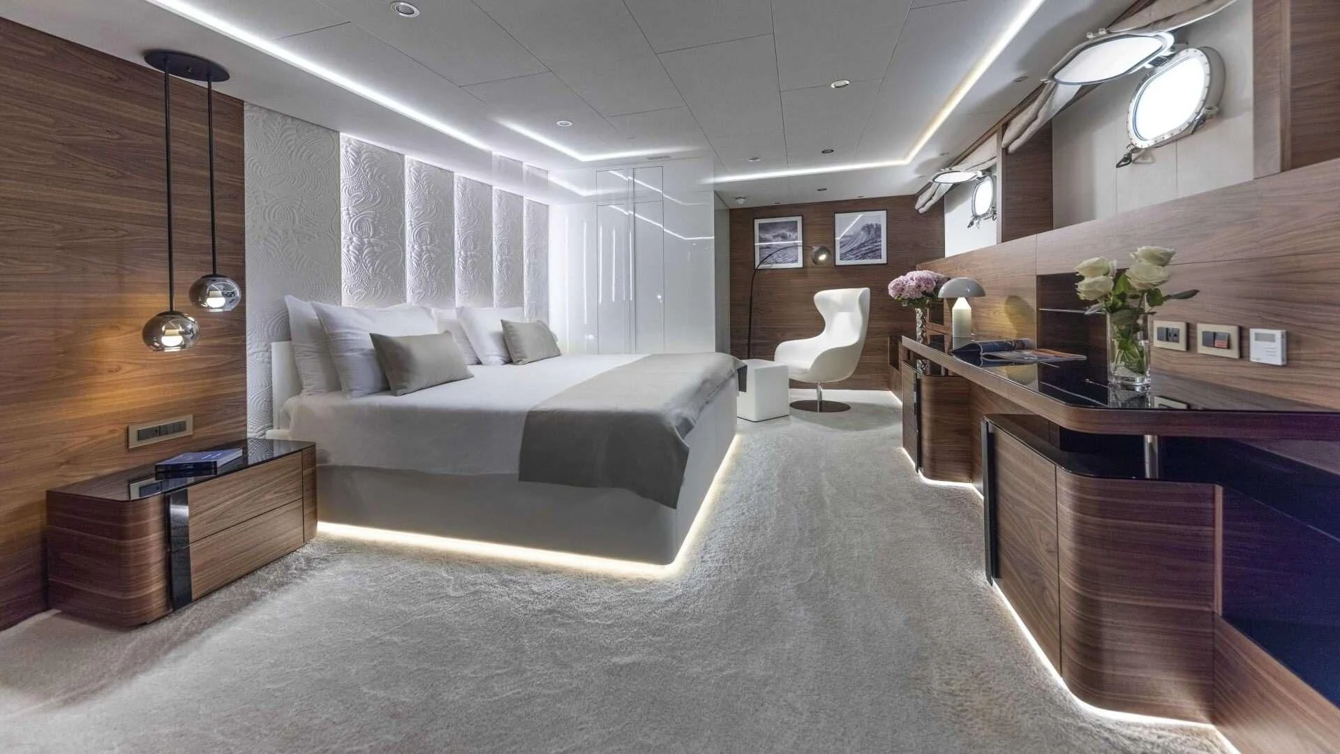 a room with a bed and a desk aboard M/Y ANTHEA Yacht for Sale