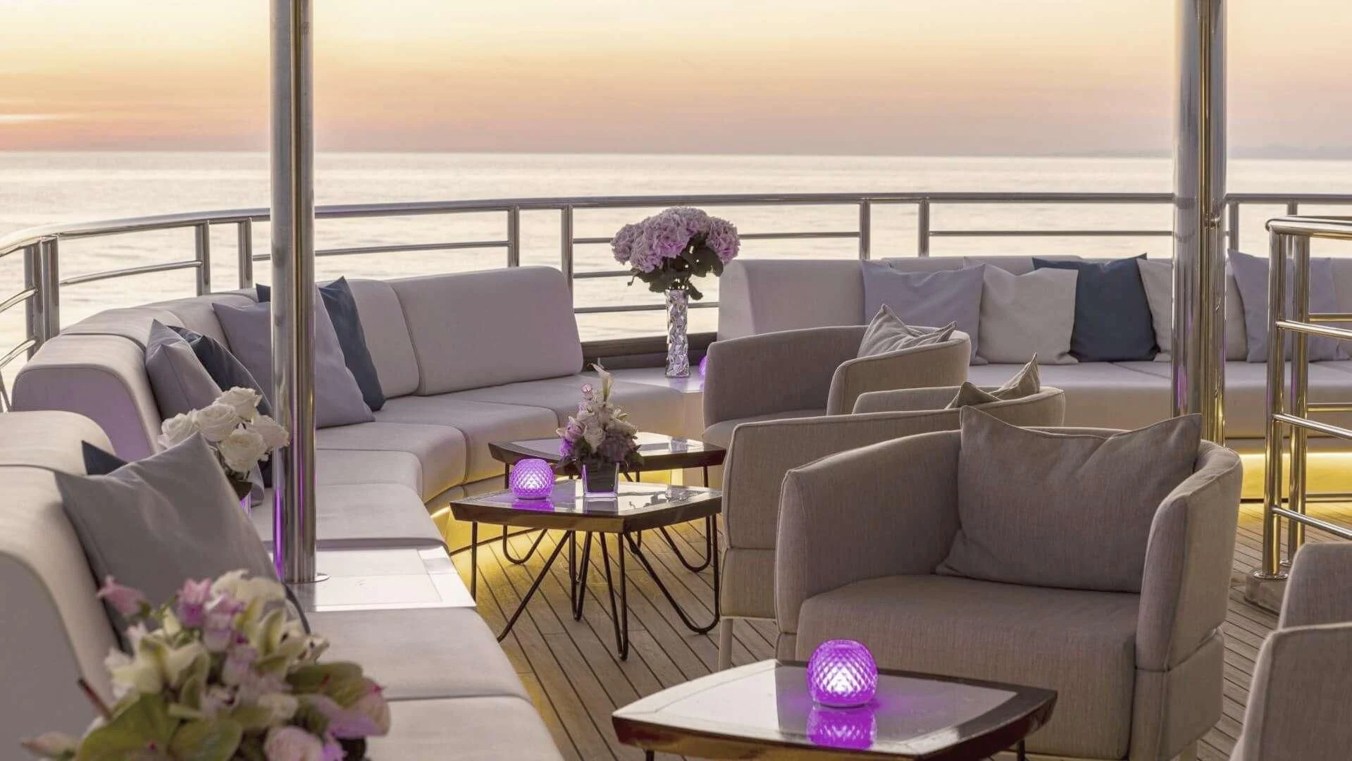a living room with a large balcony aboard M/Y ANTHEA Yacht for Sale