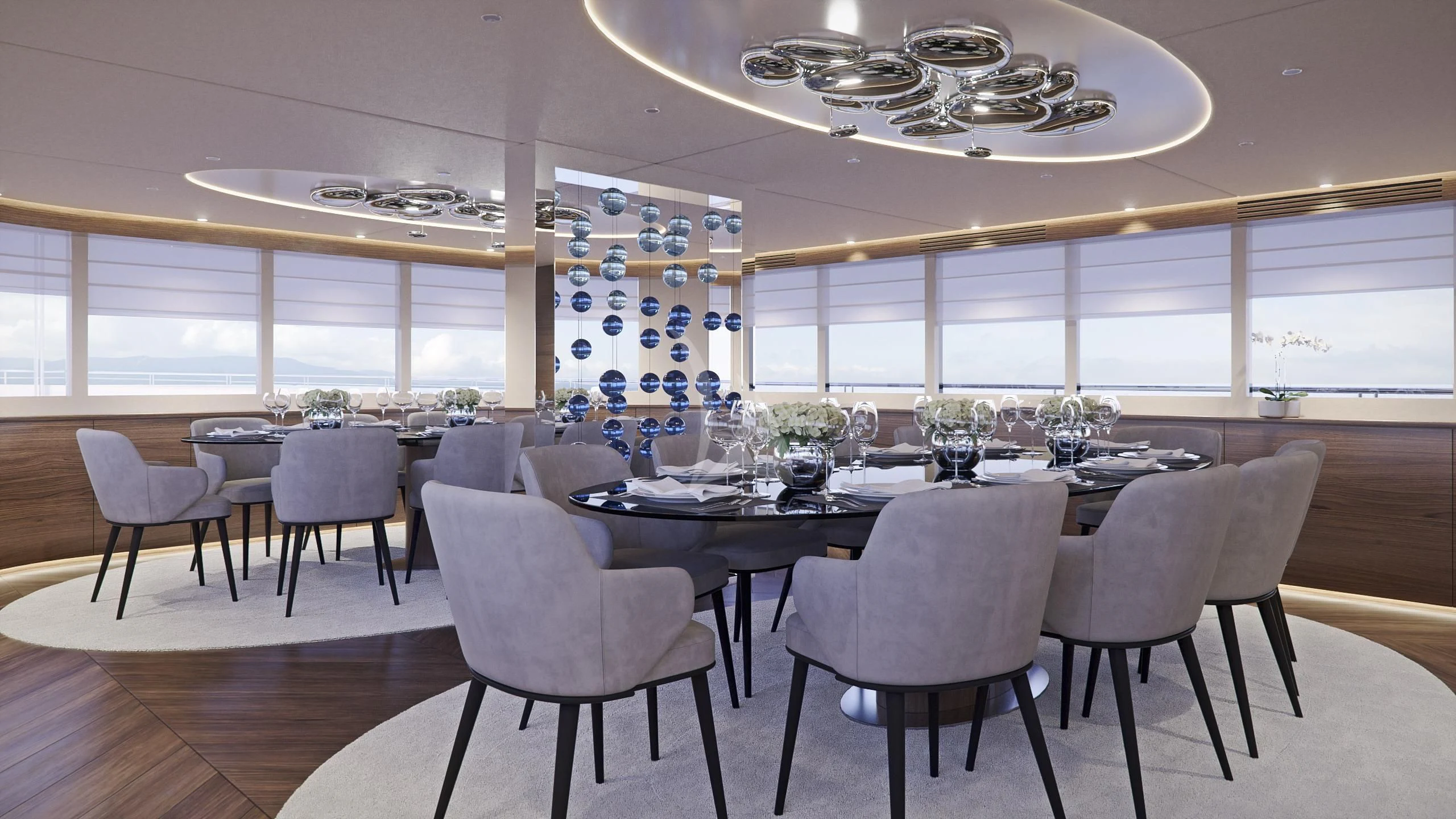 a large dining room with a chandelier aboard M/Y ANTHEA Yacht for Sale