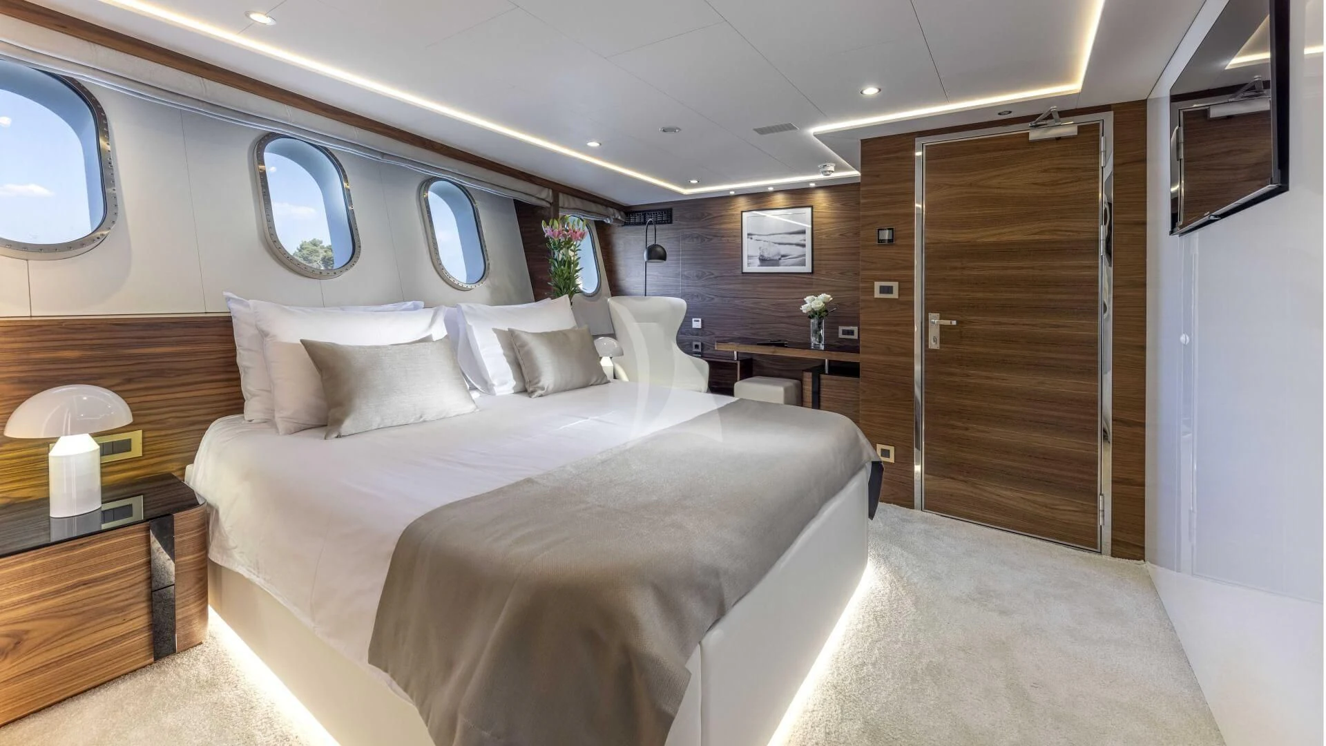a room with a bed and a mirror aboard M/Y ANTHEA Yacht for Sale