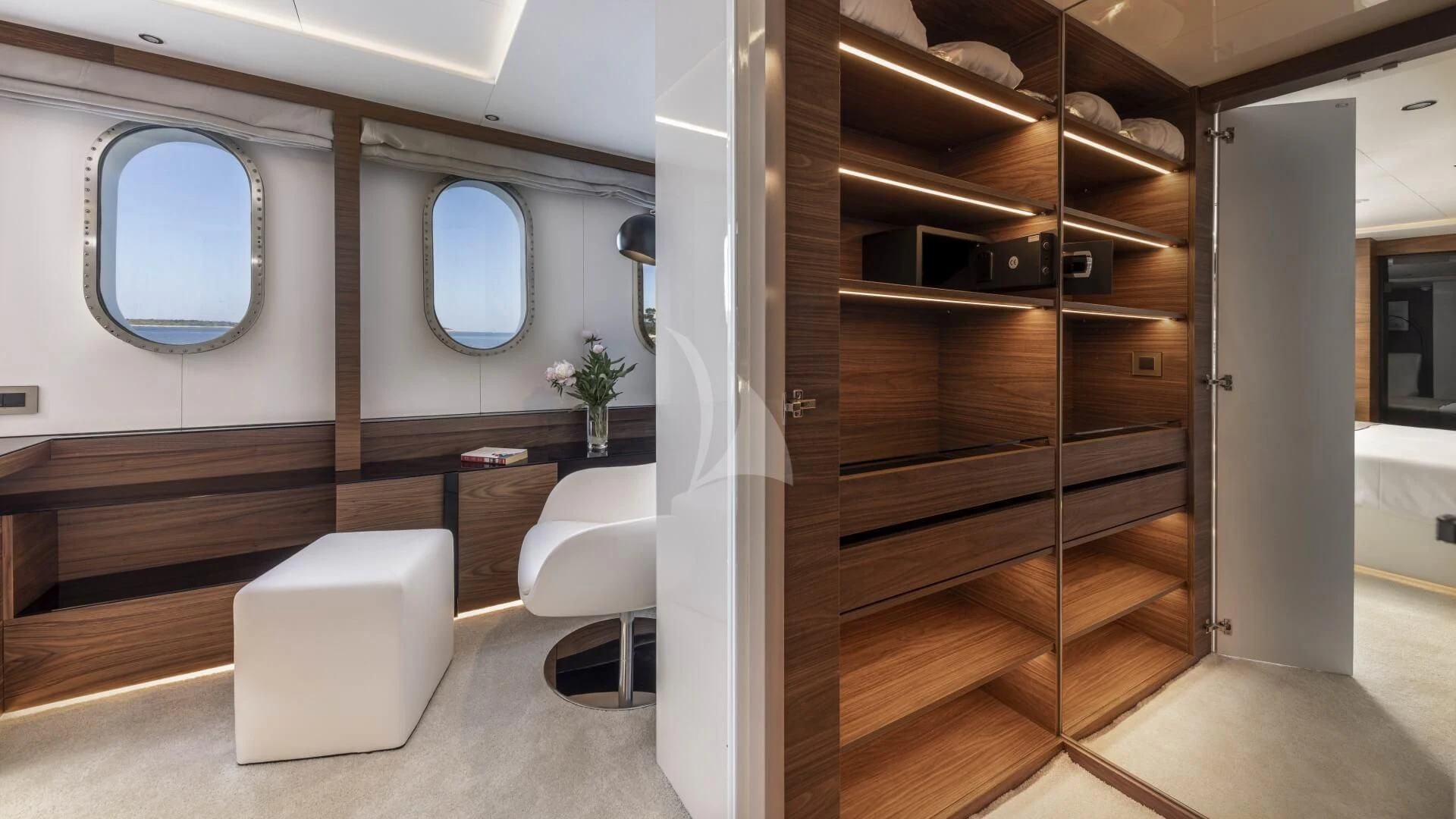 a room with a mirror and a shelf with a chair aboard M/Y ANTHEA Yacht for Sale