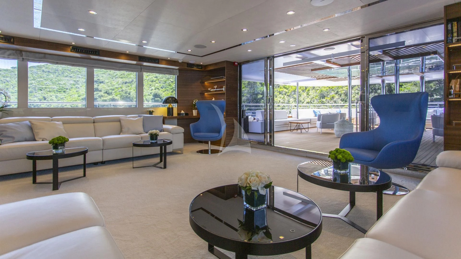 a living room with a large window aboard M/Y ANTHEA Yacht for Sale