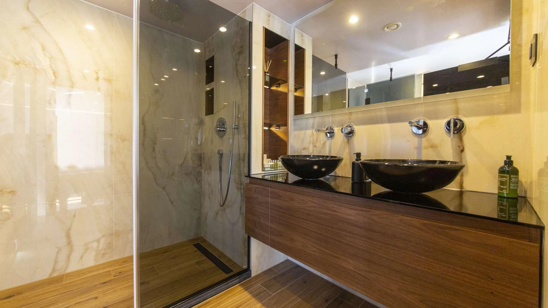 a bathroom with a large mirror aboard M/Y ANTHEA Yacht for Sale
