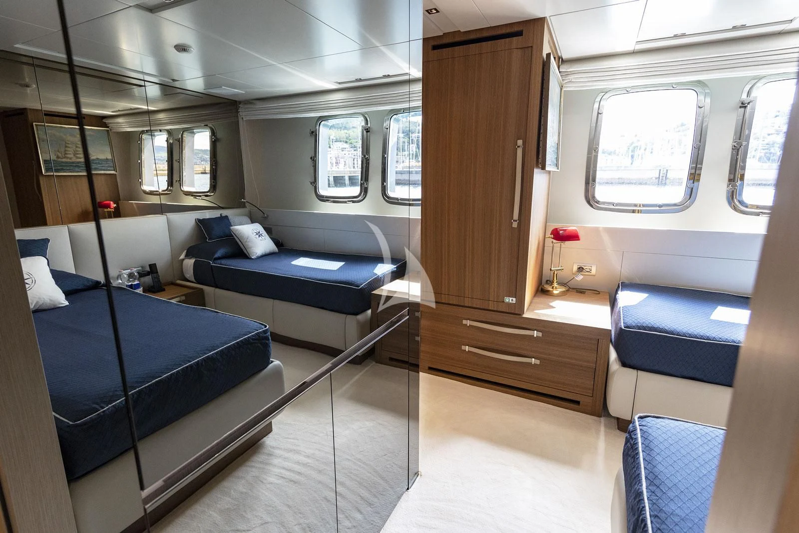 a room with a bed and a couch aboard VITTORIA Yacht for Charter